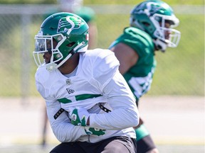 Saskatchewan Roughriders running back Jamal Morrow is handed the ball during training camp in Saskatoon at Griffith's Stadium on Tuesday, May 16, 2023.