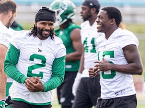 Saskatchewan Roughriders Mario Alford and Shawn Bane Jr. on the Griffith's Stadium field for Tuesday's Rider Training camp.