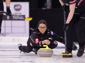 Kerri Einarson shoots a stone at the Champions Cup in Regina.