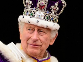 King Charles III seen on the balcony of Buckingham Palace during the Coronation of King Charles III and Queen Camilla on May 6, 2023 in London, England.