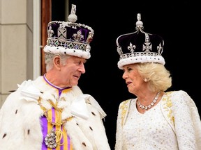 King Charles III and Queen Camilla are seen on the balcony of Buckingham Palace during the Coronation of King Charles III and Queen Camilla on May 06, 2023 in London, England, Britain. Leon Neal/Pool via REUTERS