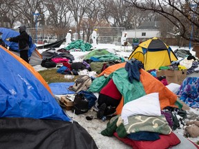 A person is seen cleaning out a tent at Camp Hope as the tent encampment was being dismantled at Pepsi Park in Regina, Saskatchewan on Nov. 15, 2021.

BRANDON HARDER/ Regina Leader-Post