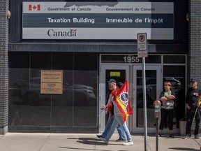 REGINA, SASK : May 1, 2023-- Picketers in Regina walk past the Taxation Building as part of the ongoing Public Service Alliance of Canada strike. Photo taken on Monday, May 1, 2023 in Regina. KAYLE NEIS / Regina Leader-Post