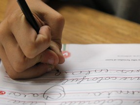 A student practices writing in cursive at St. Mark's Lutheran School in Hacienda Heights, Calif., Thursday, Oct. 18, 2012.&ampnbsp;Cursive is making a comeback. Relegated in 2006 to an optional piece of learning in Ontario elementary schools, it is set to return as a mandatory part of the curriculum starting in September.