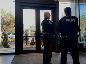 Regina Police Service officers in the lobby of city hall