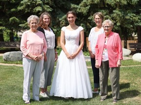Five weddings, one magical wedding dress. Isabella Thomson is getting married on July 1. She will be wearing the same dress previously worn by four women in her family. Her grandmother, Joanne (Kendall) Leier, right, was the first to get married in the bridal gown back in 1957. Joanne's sister, Darlene (Kendall) Schneider, left, was married in the dress in 1958. Isabella's aunt, Leslie (Leier) Fisher, back right, worn it for her nuptials in 1982. And the bride-to-be's mom, Lisa Thomson, back left, took her vows in the gown in 1995.
