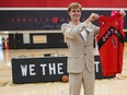 Toronto Raptors first round draft pick Gradey Dick poses for photos with a jersey after being introduced to the media in Toronto, Monday, June 26, 2023. The newest Raptors sharpshooter, chosen 13th overall in the NBA Draft last Thursday, visited his new basketball home over the weekend and was grilled by reporters after a morning workout with head coach Darko Rajaković at the team's practice facility.