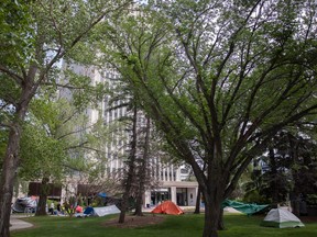 Makeshift shelters and tents pop up at City Hall as people who experience homelessness seek shelter in front of the building on Monday, June 19, 2023 in Regina.