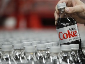 A bottle of Diet Coke is pulled for a quality control test at a Coco-Cola bottling plant on Feb. 10, 2017 in Salt Lake City, Utah.