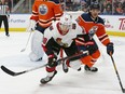 Ottawa Senators forward Connor Brown (28) and Edmonton Oilers defencemen Ethan Bear (74) chase a loose puck at Rogers Place in this file photo from Dec 4, 2019.