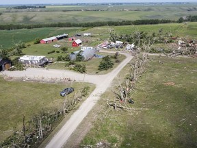 Tornado damaged homes are seen near Carstairs, Alta., Saturday, July 1, 2023.