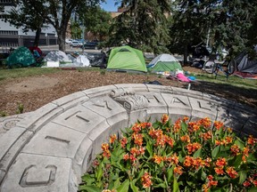 REGINA, SASK : July 5, 2023-- Multiple tents are raised outside City Hall where houses people have gathered to take shelter and join the community of people sheltering downtown on Wednesday, July 5, 2023 in Regina. KAYLE NEIS / Regina Leader-Post