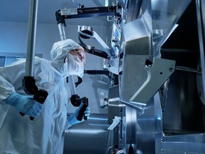 A Fedoruk Centre production technologist remotely operates for the safe manufacturing of imaging cancer diagnoses.