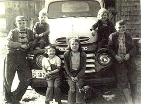 Eldridge (middle) as a child, surrounded by her five siblings and dog, Blackie.