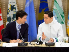 Prime Minister Justin Trudeau talks with Natan Obed, president of the Inuit Tapiriit Kanatami as they participate in the Inuit-Crown Partnership Committee Leaders Meeting in Ottawa on Thursday, March 29, 2018.
