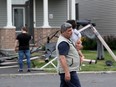 A tornado touched down in the Barrhaven area of Ottawa Thursday afternoon, ripping off roofs, smashing windows and scattering debris, forcing some residents to flee the area to shelter.