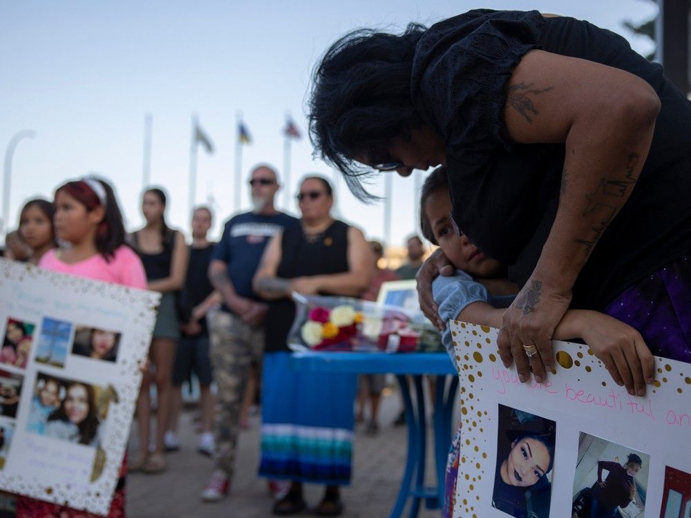 Daughter Ava Tuckanow holds to her grandmother Letisha Bigknife during the vigil for her daughter and Ava's mother, Elisa Tuckanow who died from an overdose at the makeshift tent encampment at City Hall on Monday, July 24, 2023 in Regina.