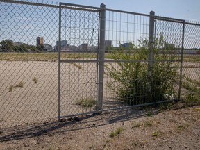 A temporary fences block entrance ways into the old Taylor Field Stadium lot to prevent houses people from setting up camp on Thursday, August 3, 2023 in Regina. KAYLE NEIS / Regina Leader-Post