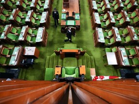 Pages prepare The House of Commons on Parliament Hill in Ottawa on Friday, Nov. 19, 2021.