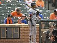 Miami Marlins star Luis Arraez stands in the on-deck circle next to the pitch clock during a game against the Baltimore Orioles, July 16, 2023, in Baltimore.