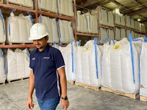 Jignesh Patel, surrounded by cubic bags of plant protein, is manager for Agrocorp's plant-protein factory in the Saskatchewan community of Cut Knife.