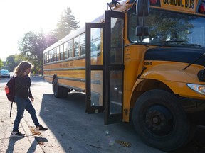 Kid getting on school bus