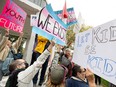 Hundreds of protesters and counter-protesters clash over gender identity in Saskatchewan's schools in downtown Saskatoon, Sask. on Wednesday, September 20, 2023.