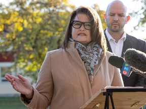 Official Opposition Leader Carla Beck and Education Critic Matt Love hold a press conference in front of Monique Rousseau elementary school which has had a gaping hole in the roof since last school year, and was recently flooded. Photo taken in Saskatoon, Sask. on Tuesday, October 10, 2023.
