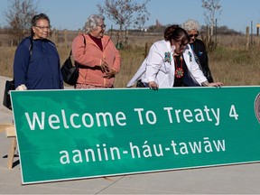 The Office of the Treaty Commissioner president Mary Culbertson (3rd from left) stands with one of the new highway signs to be placed in the Estevan, Moosomin, Lanigan and La Ronge areas to highlight treaty boundaries across Saskatchewan. Photo taken in Saskatoon, Sask. on Thursday, October 19, 2023.