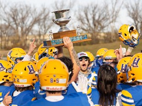Saskatoon Hilltops raise the Prairie Football Conference final trophy after defeating Regina Thunder on SMF Field at the Gordie Howe Sports Complex. Photo taken in Saskatoon, Sask. on Sunday, October 22, 2023.