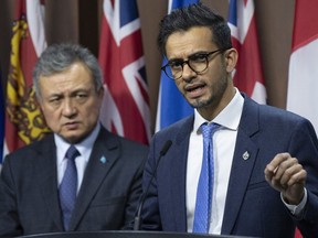 Liberal MP Sameer Zuberi speaks as World Uyghur Congress President, Dolkun Isa looks on during a news conference, Wednesday, Feb. 1, 2023 in Ottawa.