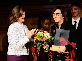 Canadian activist Cindy Blackstock (right) reacts after having been awarded with the World's Children's Prize from Sweden's Queen Silvia for her 30-year-long fight for indigenous children's right to education, school and health during the award ceremony at Gripsholm Castle in Mariefred, Sweden on October 4, 2023.