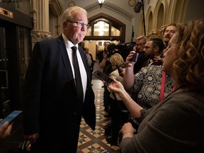 Defence Minister Bill Blair speaks with reporters as he makes his way to cabinet, Tuesday, Oct. 24, 2023 in Ottawa. Blair says Hamas is a terrorist organization that is a threat to the whole world and must be eliminated.