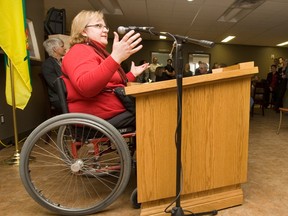 Paralympian Heather Kuttai speaks at the height adjustable podium on April 6, 2010 in Saskatoon. The motorized podium moves up and down and is available to anyone who wants to use it.