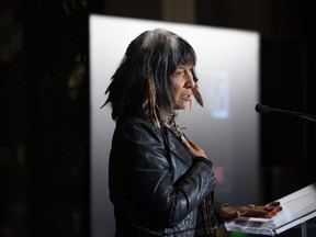 Buffy Sainte-Marie speaks after the unveiling of a Canada Post stamp honouring her legacy as a singer-songwriter, in Ottawa, on Thursday, Nov. 18, 2021.