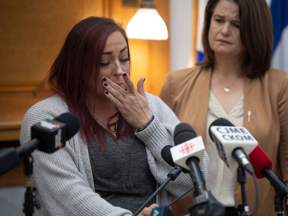 Sarah Mackenzie, who lost her fourteen-year-old child to suicide, speaks at the Saskatchewan Legislative Building about her experiences with mental health support and how she believes that due to a lack of services her child suffered. Mackenzie wipes a tear after discussing details of the suicide on Thursday, Oct. 12, 2023 in Regina.