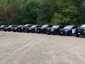 Dozens of OPP vehicles are parked at the Port Burwell fire hall on Sept. 28, 2023, for what police at the scene called "a contentious eviction." (Heather Rivers/The London Free Press)