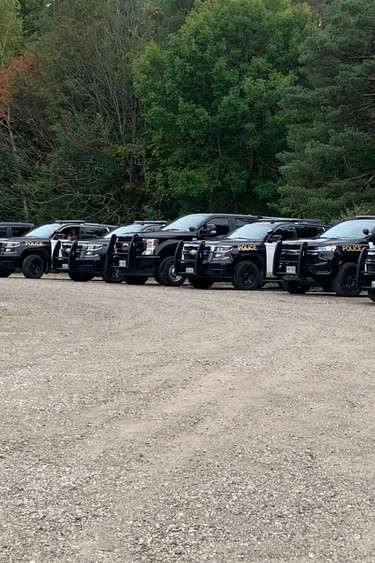 Dozens of OPP vehicles are parked at the Port Burwell fire hall on Sept. 28, 2023, for what police at the scene called "a contentious eviction." (Heather Rivers/The London Free Press)