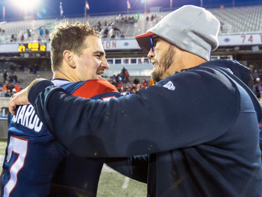 Montreal Alouettes head coach Jason Maas hugs quarterback Cody Fajardo following Canadian Football League East semi-final playoff victory against the Hamilton Tiger-Cats in Montreal Saturday November 4, 2023.