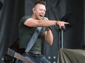 Luke Hunter, bassist with the Hunter Brothers, performs at the 2019 Country Thunder music festival in Calgary.