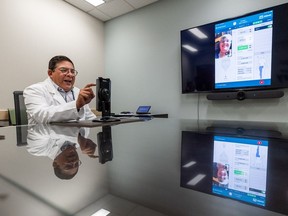 Dr. Ivar Mendez speaks to a patient from Regina via a specialized program that allows management of pain remotely. Dr. Mendez is the head of the Department of Surgery at the University of Saskatchewan. Photo taken in Saskatoon, SK on Tuesday, August 23, 2022.