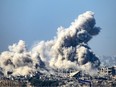 This picture taken from southern Israel near the border with the Gaza Strip shows smoke rising from buildings after being hit by Israeli strikes, as battles resume between Israel and Hamas militants, on Dec. 1, 2023. A temporary truce between Israel and Hamas expired on Dec. 1, with the Israeli army saying combat operations had resumed, accusing Hamas of violating the operational pause.