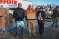 Staff and volunteers with Prince Albert Grand Council distribute 3,500 Christmas food hampers in December 2023.