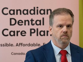 Minister of Health Mark Holland listens to a question following an announcement on dental care, Monday, December 11, 2023 in Ottawa.
