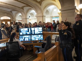A Peace Officer gives a safety briefing to a group of Palestinian supporters before question period on Monday, November 20, 2023 in Regina.