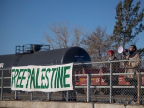 Protesters stage a rail blockade on Albert Street and Saskatchewan Drive in Regina in support of Palestine on Nov. 29.