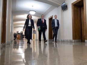 Minister of Justice and Attorney General Bronwyn Eyre, Premier Scott Moe and Minister of Education Jeremy Cockrill walk out of a press conference after passing Bill 137 at the Saskatchewan Legislative building on Friday, October 20, 2023 in Regina.