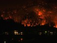 Severe weather and natural disasters caused more than $3 billion in insured damages for the second year in a row in 2023. The McDougall Creek wildfire burns on the mountainside above houses in West Kelowna, B.C., Friday, Aug. 18, 2023.