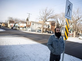 Jon Lorenc a board member of the Cathedral Village Community Association stands beside a cross walk on 13th avenue on Wednesday, January 3, 2024 in Regina.