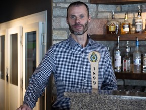 General manager Ryan Pollock at the tap for 1899 Lager, the beer commemorating the Royal Regina Golf Club's 125th birthday